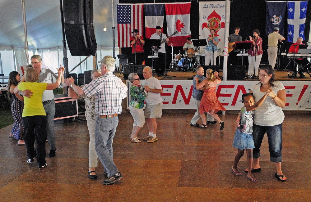 Dancers circle the floor as La Famille LeBlanc plays at the Festival de la Bastille on July 11, 2014 in Augusta. This year's festival is set for July 8 and 9.