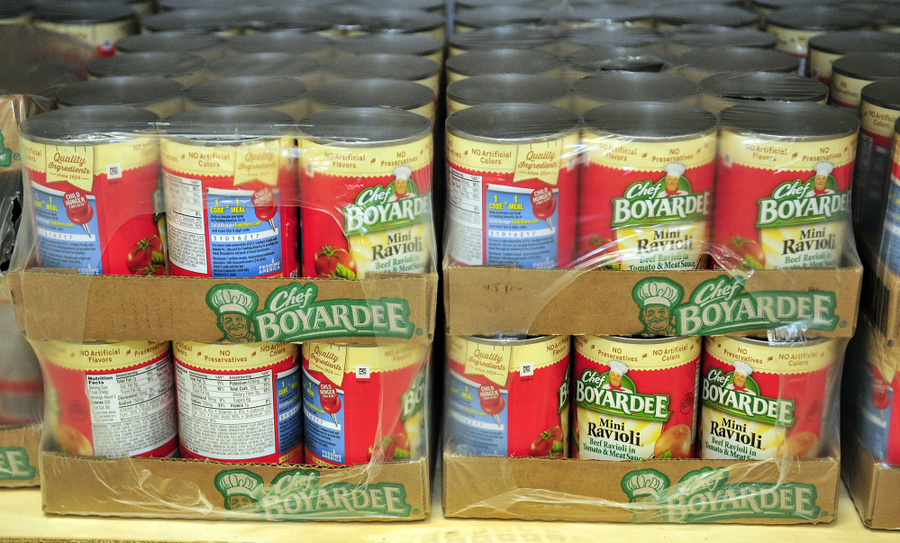 Canned pasta and other items sit on the shelves of the new food bank Thursday at the Augusta Boys and Girls Club in the Buker Community Center in Augusta.