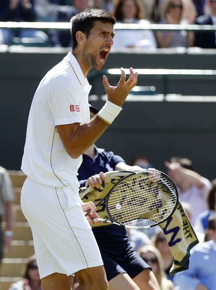 Novak Djokovic reacts after losing a point to Sam Querrey during their men's singles match at Wimbledon on Saturday in London. Djokovic lost 7-6 (6), 6-1, 3-6, 7-6 (5)