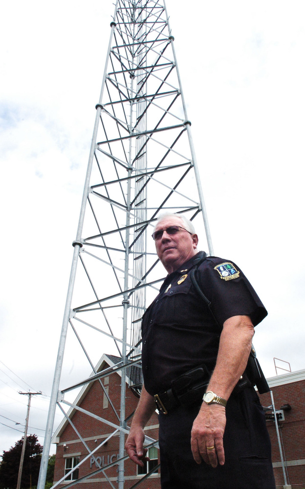 Waterville Police Chief Joe Massey beside the new radio communications tower outside the department on Tuesday.