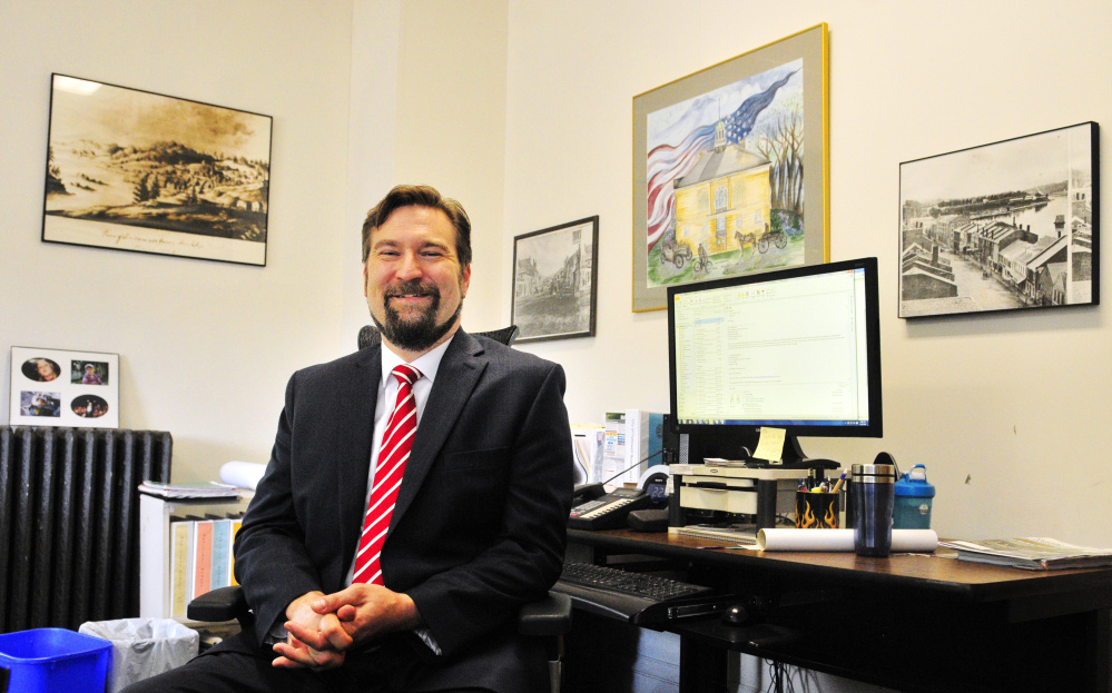 New Hallowell City Manager Nate Rudy poses for a photo on Thursday in City Hall.