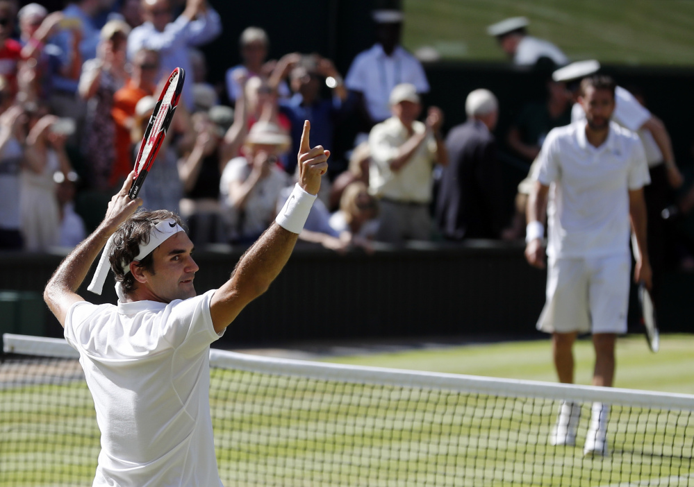 Roger Federer celebrates at match point after beating Marin Cilic in a Wimbledon singles match Wednesday in London.