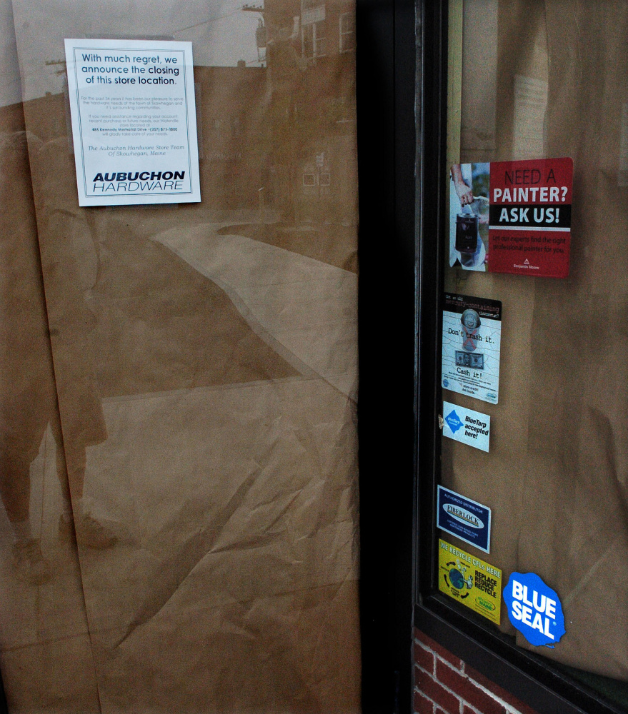 The entrance door to the Aubuchon Hardware store in Skowhegan was covered in brown paper Thursday with a sign announcing the business has closed.