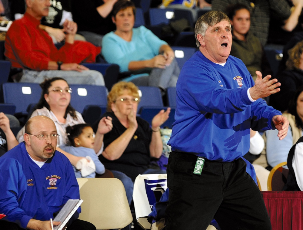 Mt. Abram girls basketball coach Doug Lisherness urges his team on during a 2008 Western C tournament game at the Augusta Civic Center.