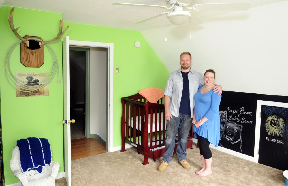 New homeowners Steve and Abby Utecht stand in the nursery of their new home Friday in Richmond.