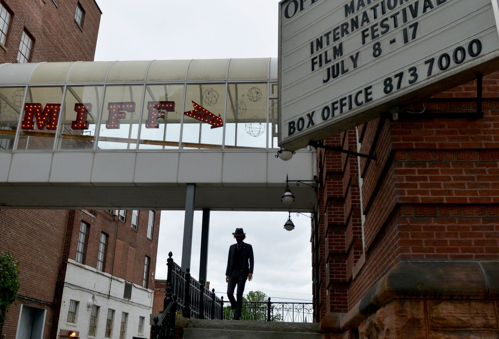 A man walks into the Waterville Opera House on Friday for the opening night of the Maine International Film Festival.