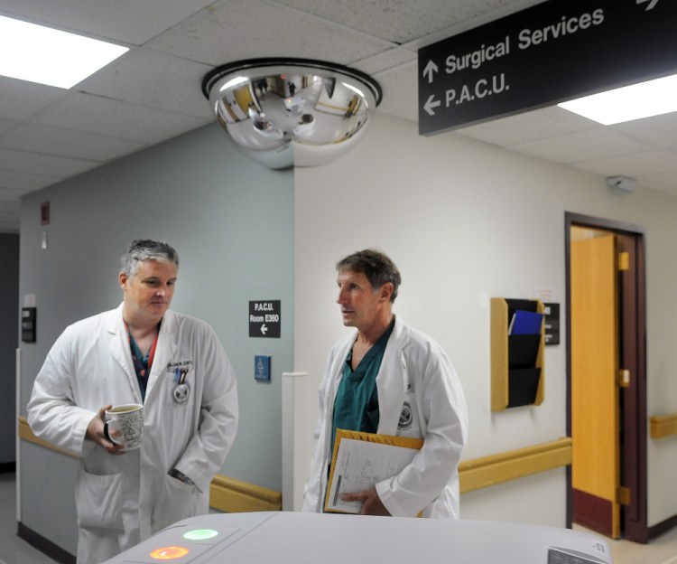 Dr. William Curtis, left, and Dr. Cameron McKee speak Monday on the surgical floor of the VA Maine Healthcare Systems-Togus during a tour of the veterans hospital.