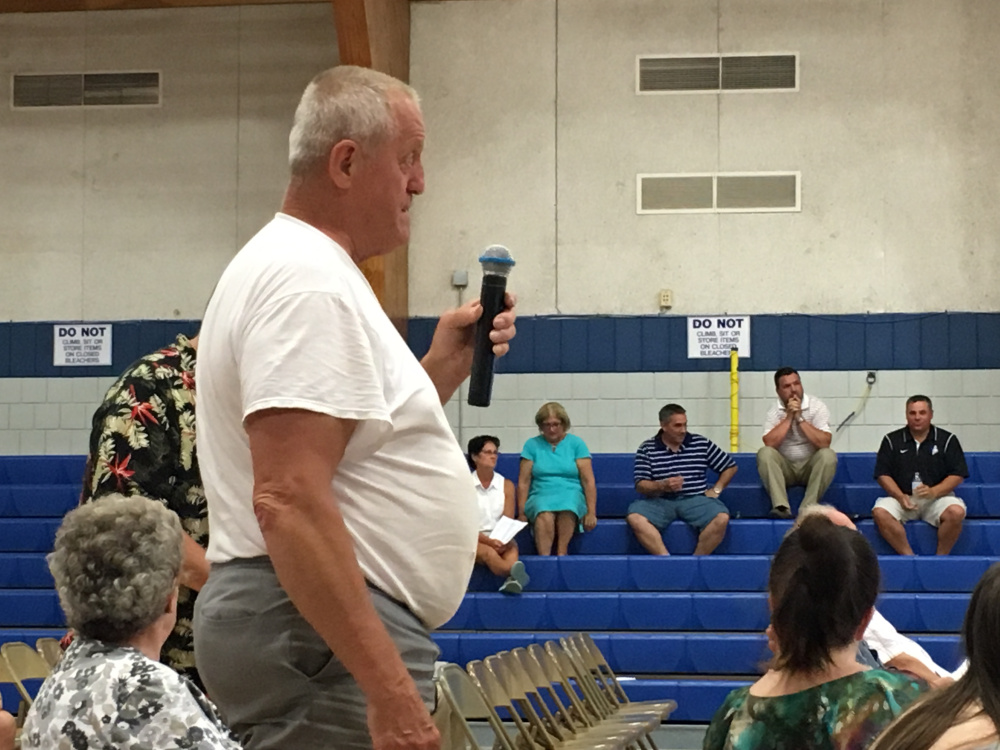 Robert Ayotte, a Sabattus resident, asks a question Wednesday evening of the Regional School Unit 4 school board at a district budget meeting. About 40 voters attended the meeting and gave their tentative approval to an $18.8 million budget, which residents in Litchfield, Sabattus and Wales will vote on July 26.