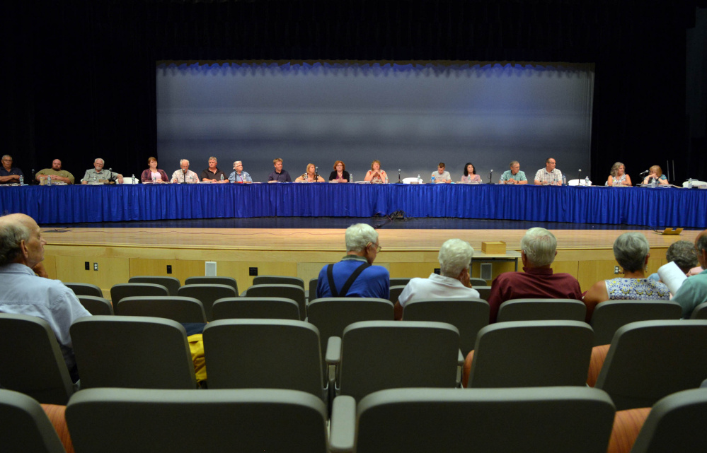 The Regional School Unit 9 board of directors presides over a districtwide school budget meeting Thursday in Bjorn Auditorium at Mt. Blue High School in Farmington.