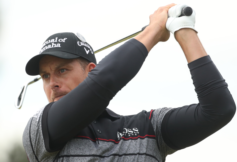 Henrik Stenson hits his tee shot from the 12th hole. Stenson set a record for lowest 72-hole score in a major championship, finishing at 20-under 264.