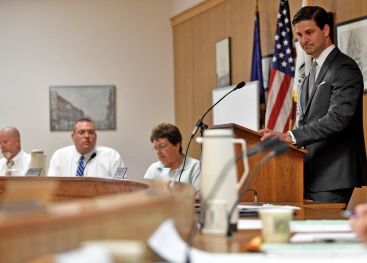 Waterville Mayor Nick Isgro, center, listens to city councilors during budget discussions June 21. Councilors on Tuesday plan to vote on whether to override Isgro's veto of the budget, following council approval earlier this month.