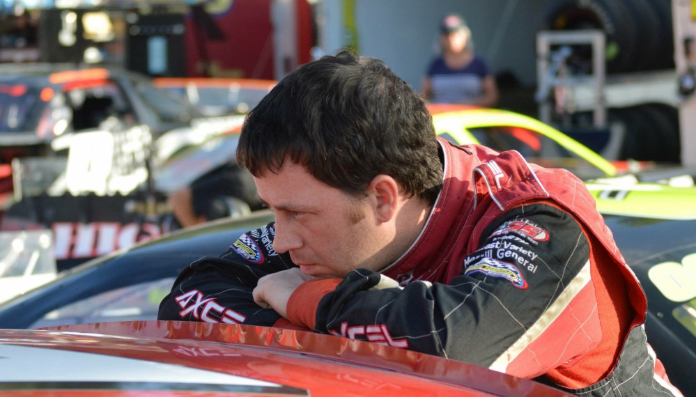 Travis Benjamin, of Morrill, takes a break between between practice sessions at a recent Pro All Stars Series race at Beech Ridge Motor Speedway.