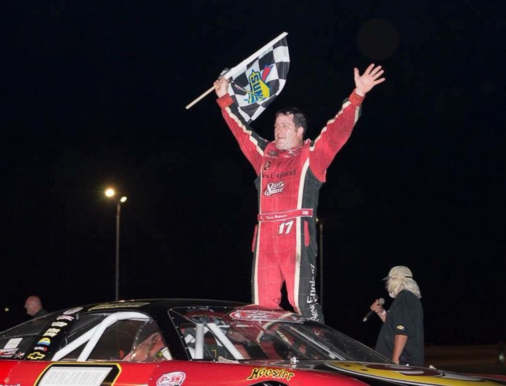 Travis Benjamin, of Morrill, celebrates his Pro All Stars Series victory at Beech Ridge Motor Speedway in Scarborough on July 12.