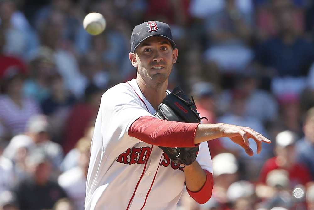 Boston's Rick Porcello throws to first base on the groundout by Minnesota's Eduardo Nunez during the fifth inning Sunday in Boston. Porcello allowed five runs on six hits while striking out eight and walking one.