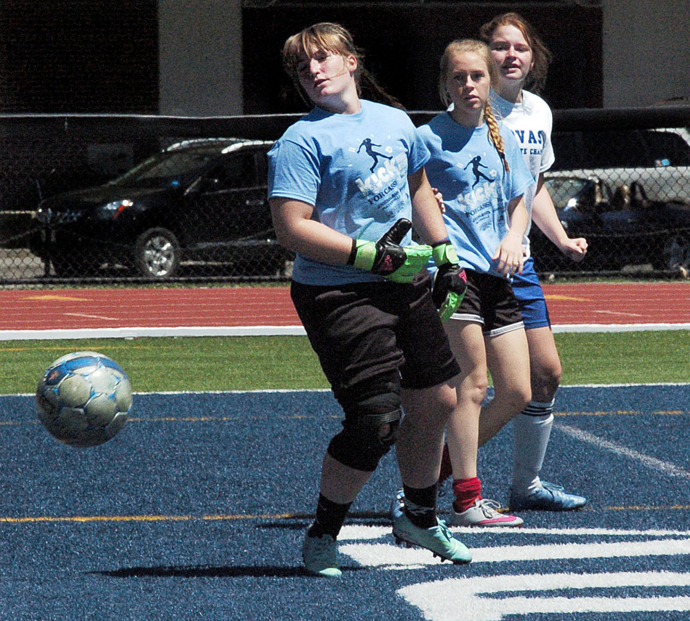 A Mt. Blue shot gets past Waterville goalie Gabi Martin during a marathon soccer game to benefit the ShineOnCass Foundation on Sunday at Colby College.