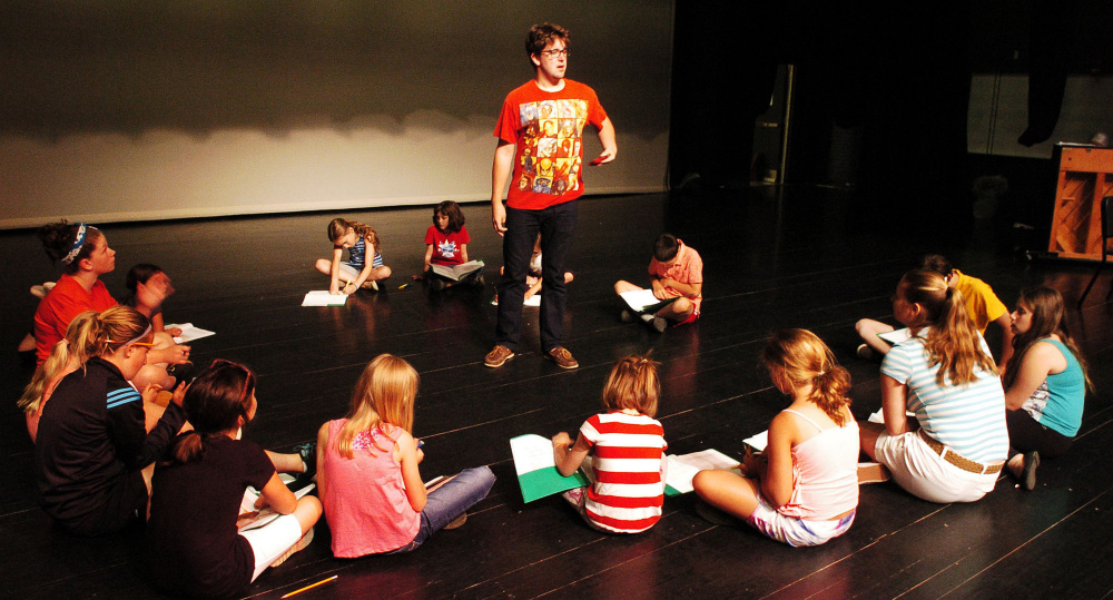 Farmington Children's Summer Theater Camp assistant director Matt West leads children during a rehearsal last week at Mt. Blue High School in Farmington.