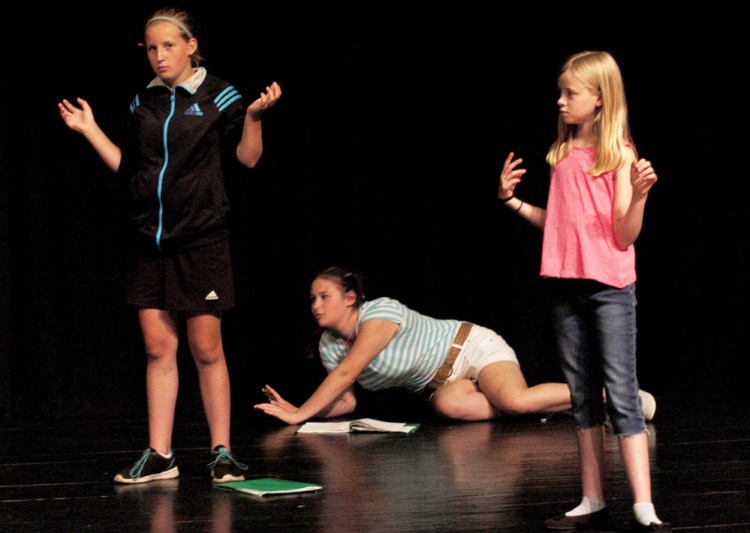 Children rehearse last week during a Farmington Children's Summer Theater Camp in Farmington. From left are Emma White, Iliana Marquez and Lydia Schofield. The group performs this Friday and Saturday.