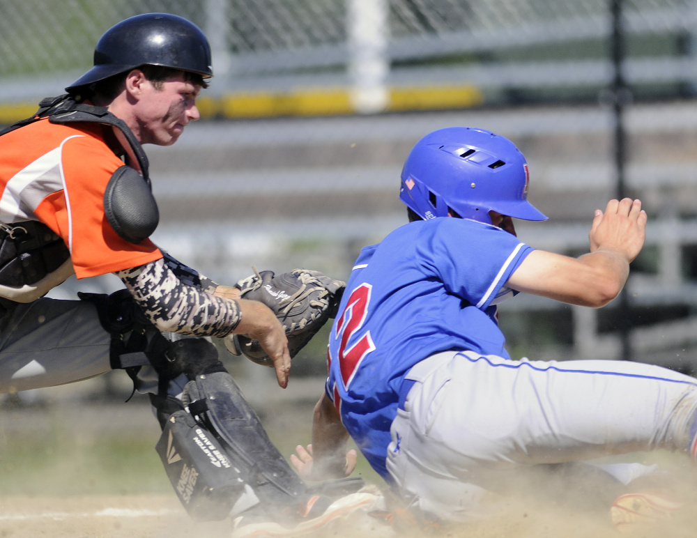 Skowhegan catcher Will Stinson tags out Yankee Ford's Alex Livingston during the American Legion state tournament Wednesday in Augusta.