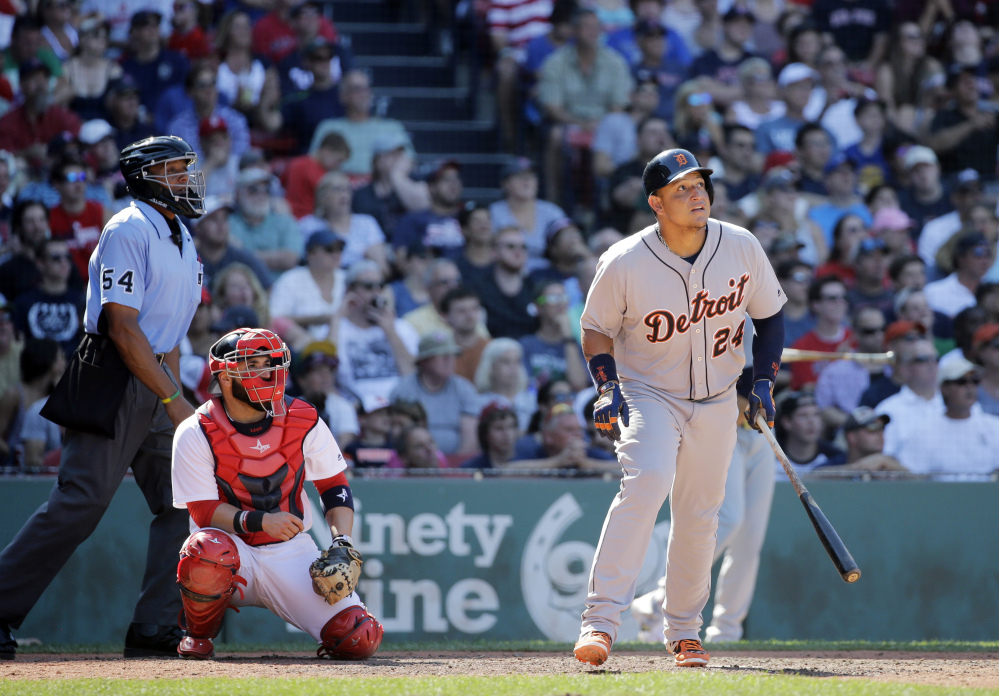 Detroit's Miguel Cabrera watches his solo homer along with Boston catcher Sandy Leon in the ninth inning Wednesday at Fenway Park in Boston. The home run gave the Tigers a 4-3 win.