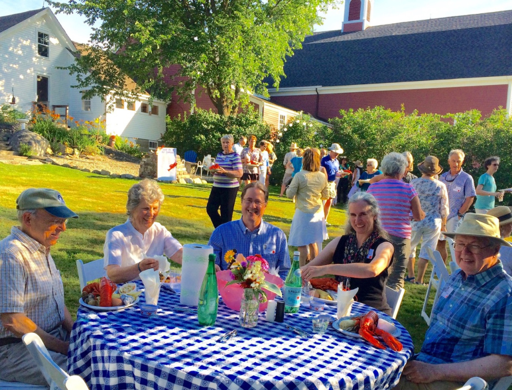 Marty Fox, left, and the Danielson family enjoy a traditional lobster bake during the Lincoln County Historical Association's Kermess on July 24 at the Foye-Sortwell Farm in Wiscasset. Yarmouth's Pan Fried Steel band added to the festive mood of the fundraiser to support LCHA's three historic sites, the Pownalborough Court House, Museum & Old Jail, and Chapman-Hall House.
