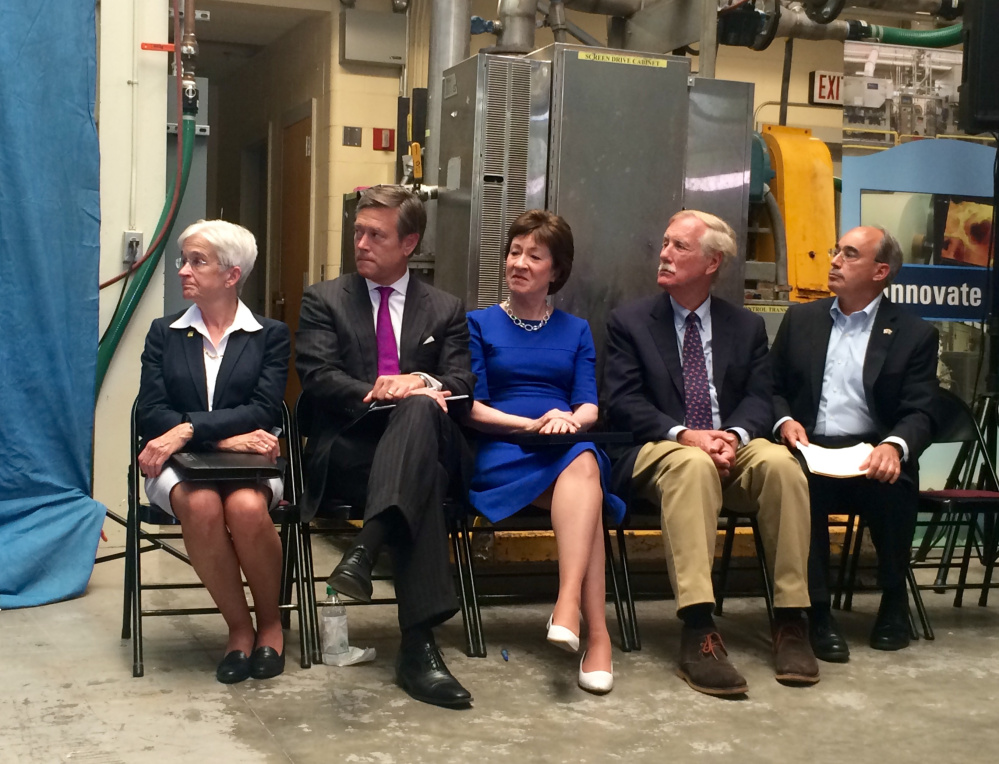 From left, University of Maine President Susan Hunter; Matt Erskine, U.S. deputy assistant director of commerce for economic development; U.S. Sen. Susan Collins; U.S. Sen. Angus King; and U.S. Rep. Bruce Poliquin listen to remarks at a news conference Friday announcing plans for the federal government to invest in and assess the state's forest products industry.