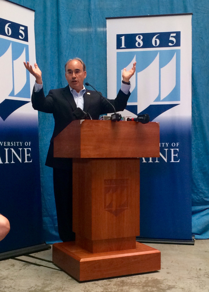 U.S. Rep. Bruce Poliquin talks about the high energy costs in Maine as a barrier to success for the state's paper industry at a news conference Friday at the University of Maine, in Orono.