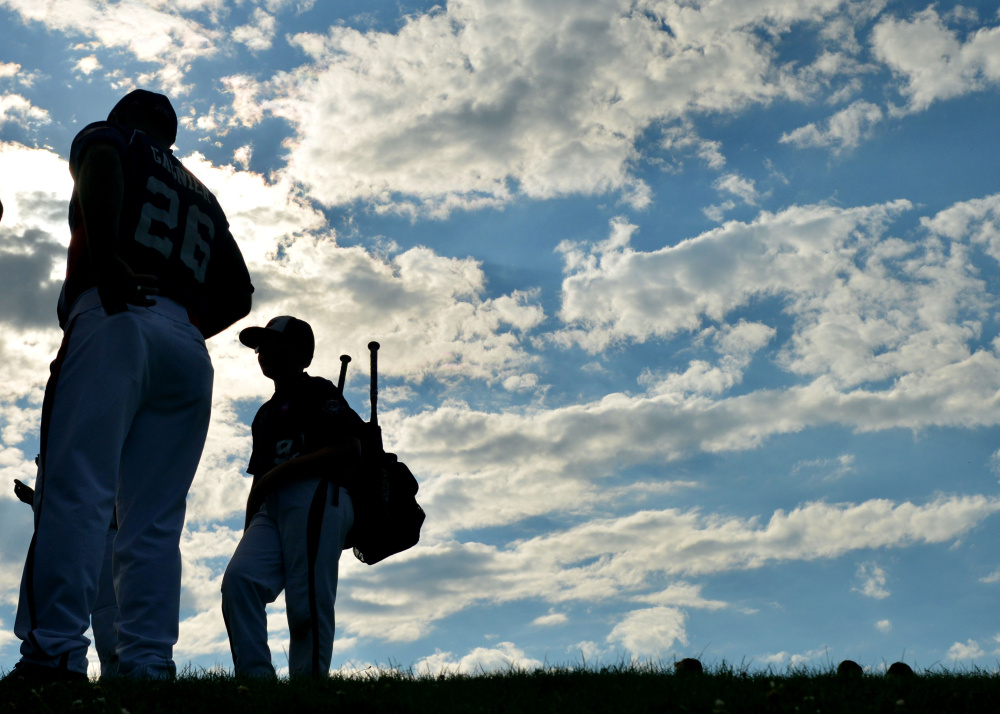  Players from Freetown/Lakeview, Massachusetts hang out after the Cal Ripken U12 home run derby at Carl Wright Complex in Skowhegan on Friday.