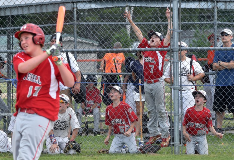  Peperrell, Massachusetts Cal Ripken players celebrate in the background as teammate Connor Rocco Lamonica hits a home run during the Cal Ripken U12 home run derby at Carl Wright Complex in Skowhegan on Friday.