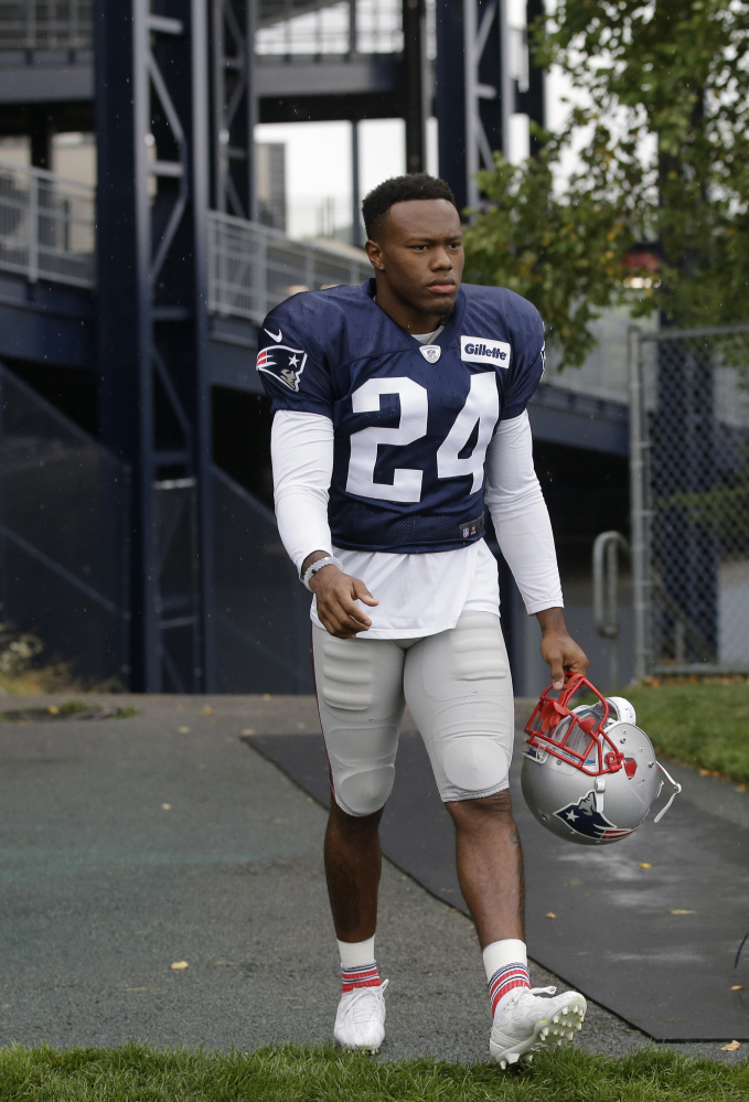New England Patriots cornerback Cyrus Jones (24) steps onto the field at the start of an NFL football training camp practice Sunday, July 31, 2016, in Foxborough, Mass. (AP Photo/Steven Senne)