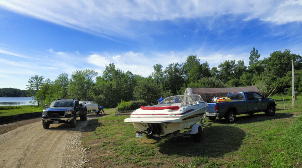 Employees work on boats Saturday at Beacon Boat Rental in Wayne.