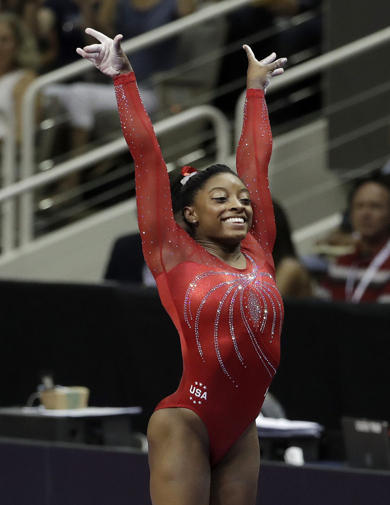 Simone Biles sticks her landing after her vault routine on her way to winning the Olympic gymnastics trials Sunday in San Jose, California.