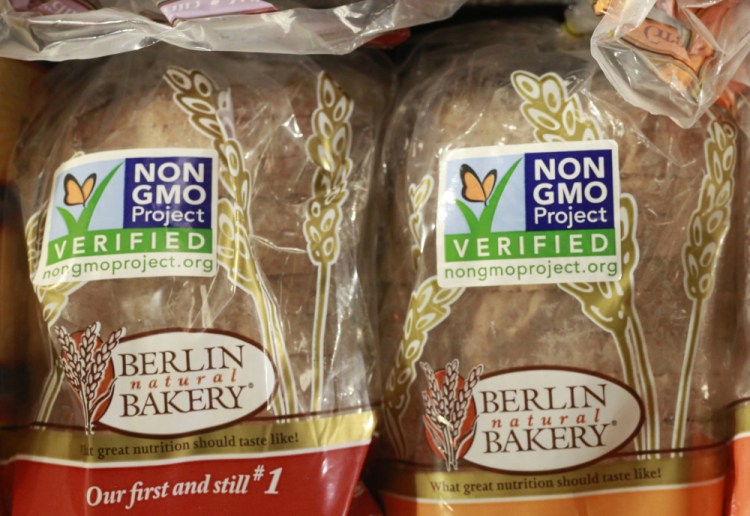 Products labeled as containing no Genetically Modified Organisms, or GMOs, are sold at a store. A new bill would give the U.S. Agriculture Department two years to write new labeling rules.