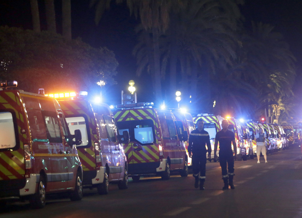 Ambulances line up near the scene of Thursday's attack on the Promenade des Anglais in Nice, France, a street lined with palm trees and grand hotels.
