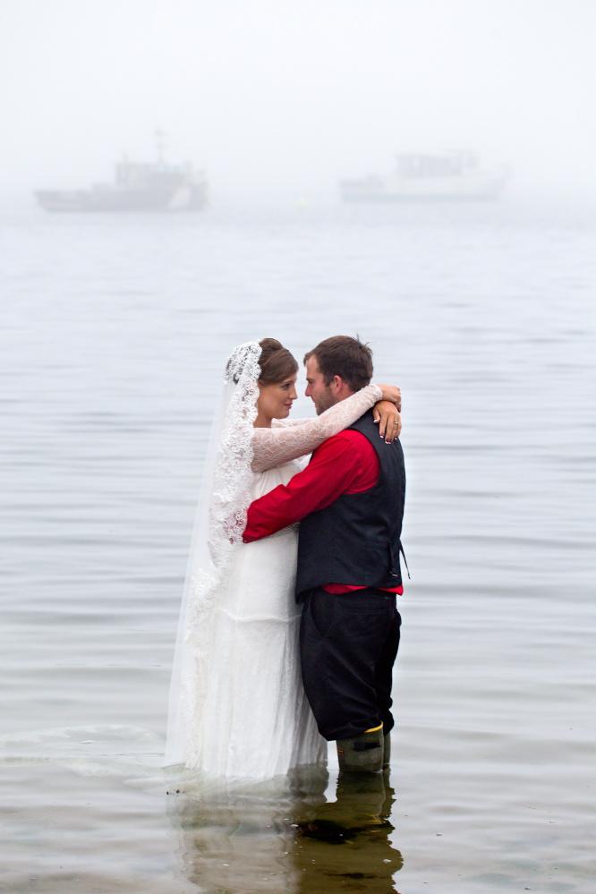 Jon and Melinda Popham mark their wedding vows with a wade into the ocean waters that the lobsterman hoped would finance their future.