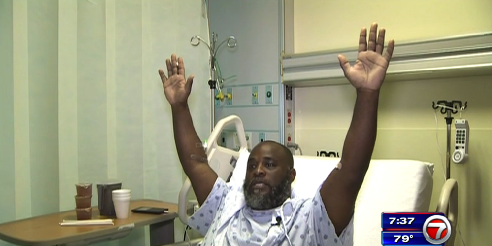 Charles Kinsey explains in an interview from his hospital bed in Miami how he was shot by police on Monday as he was trying to calm an autistic patient in the middle of the street. He said he had his hands in the air and repeatedly told the police that no one was armed.