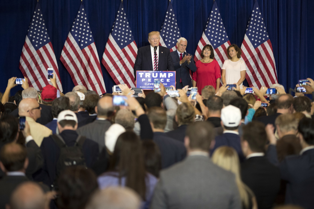 Republican presidential candidate Donald Trump speaks at an goodbye reception with friends and family following the Republican National Convention on Friday in Cleveland. Also appearing are vice presidential running mate Gov. Mike Pence, R-Ind., Karen Pence, and Charlotte Pence.