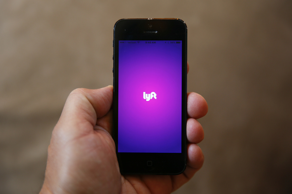 A smartphone displays the Lyft app. The ride-sharing service has been advertising for drivers in Portland.
