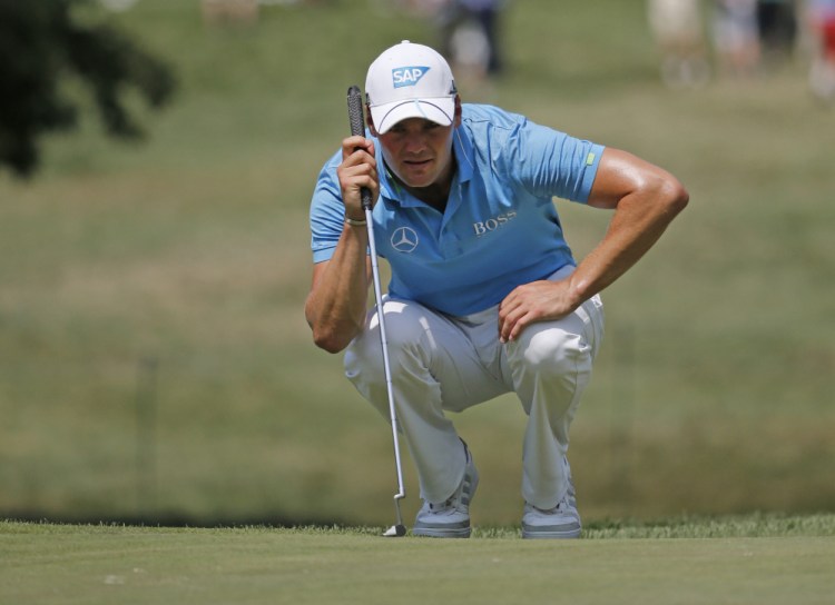 Martin Kaymer lines up a putt on the 15th hole during the first round of the PGA Championship golf tournament at Baltusrol Golf Club in Springfield, N.J., on Thursday.