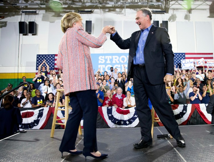 Democratic presidential candidate Hillary Clinton fist bumps Sen. Tim Kaine, D-Va., after speaking at a rally in Annandale, Va., last Thursday. Andrew Harnik/Associated Press