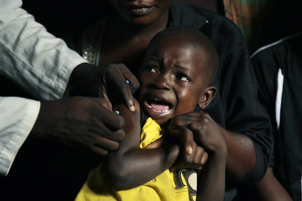 A boy reacts as he receives a yellow fever vaccine injection in the Kisenso district of Kinshasa, Congo, on July 21. Associated Press/Jerome Delay