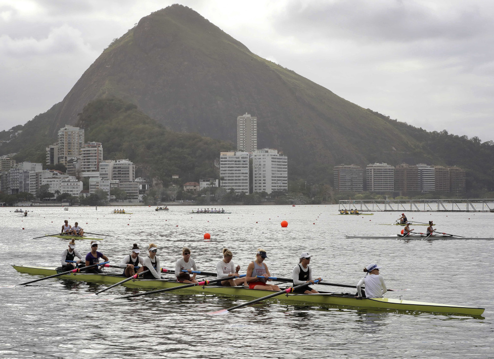 The women's eight rowing team from the United States, including Eleanor Logan of Boothbay Harbor third from the right, warms up during team practices ahead of the Summer Olympics in Rio de Janeiro. The opening ceremonies are Friday night.