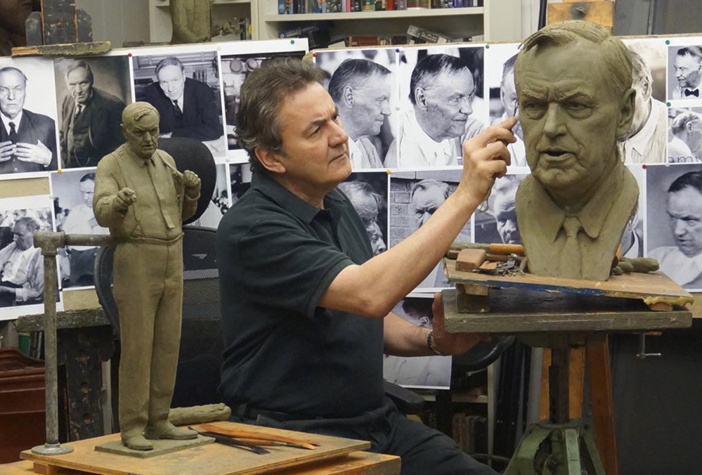 Left photo: Sculptor Zenos Frudakis works on a statue of attorney Clarence Darrow in his studio in Glenside, Penn. Right photo: A historical marker stands outside the Rhea County Courthouse where the Scopes "monkey trial" was held in Dayton, Tenn.