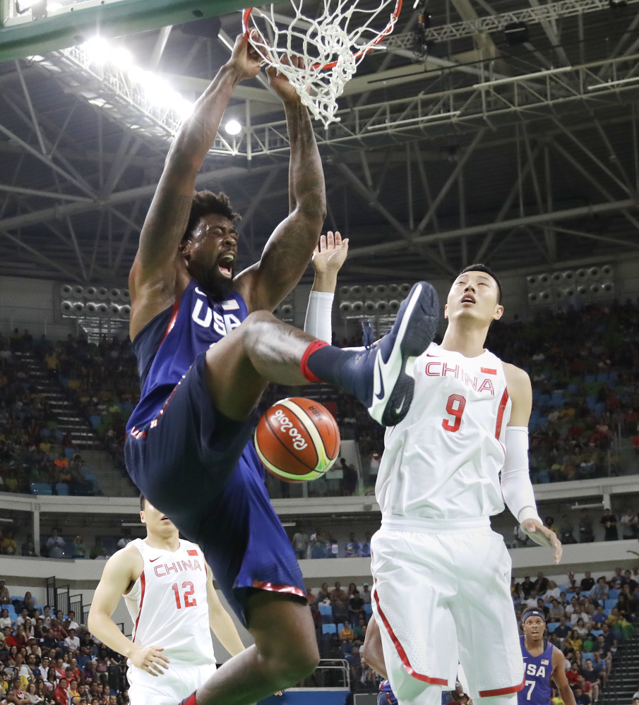 DeAndre Jordan adds a slam dunk over Zhai Xiaochuan of China, all part of an Olympics-opening 119-62 victory at Rio de Janeiro. The U.S. men will take on Venezuela in their second group game Monday.
