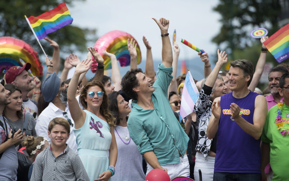 Canadian Prime Minister Justin Trudeau his wife, Sophie Gregoire Trudeau, center left, and their children Hadrien, Ella-Grace and Xavier, take part in the Pride Parade in Vancouver, Canada, on July 31.
