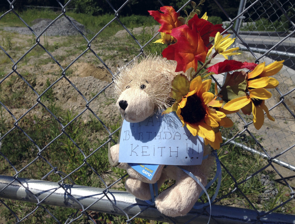 A stuffed animal hangs from a chain link fence that surrounds the site of a 2003 nightclub fire that killed 100 people in West Warwick, R.I. The memorial to mark the site of the fire is nearing completion, and organizers say they have raised more than $1.9 million out of the $2 million needed to build it and maintain it in perpetuity. 
AP Photo/Michelle R. Smith