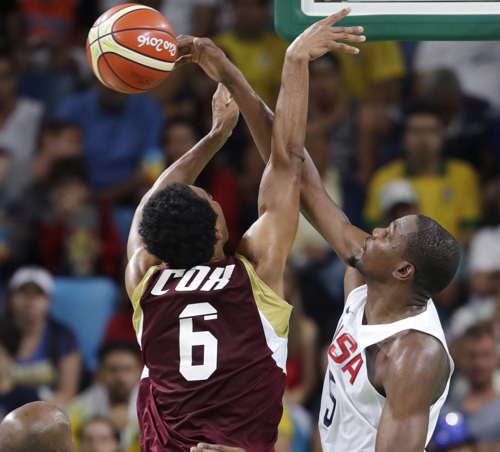 Kevin Durant of the United States, right, blocks a shot by Venezuela's John Cox during the U.S. men's team's 113-69 win Monday in Rio de Janeiro.