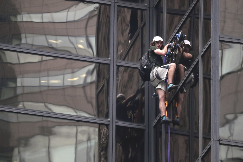 A man scales the glass facade of Trump Tower in New York on Wednesday using suction cups. The 58-story building is Donald Trump's home and the headquarters to the Republican presidential nominee's campaign.