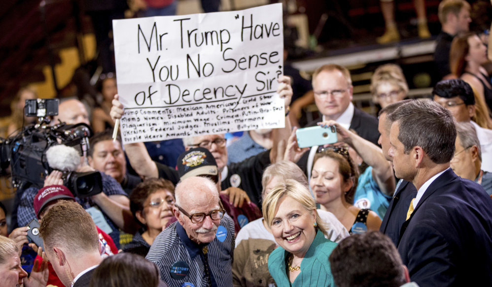 Democratic presidential nominee Hillary Clinton interacts with participants at a rally in Des Moines, Iowa, on Wednesday. She said Donald Trump's recent remarks to Second Amendment supporters show he lacks the temperament to be commander-in-chief.