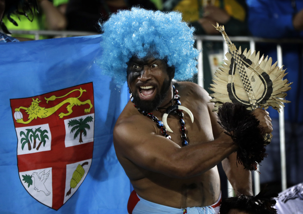 A Fiji fan celebrates his country's gold medal victory over Britain on Thursday in the men's rugby sevens. It was Fiji's first Olympic championship.