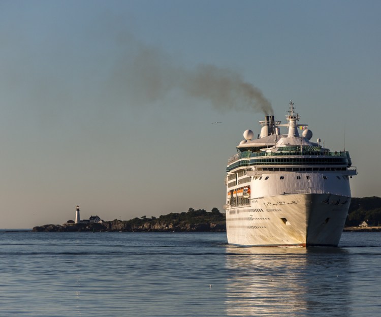 Smoke billows from the stack as the cruise ship Grandeur of the Seas enters Portland Harbor earlier this month with 1,950 passengers.